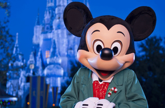 Mickey Mouse welcomes guests to celebrate the holiday season during Mickey's Very Merry Christmas Party at Walt Disney World Resort in Lake Buena Vista, Fla. 
