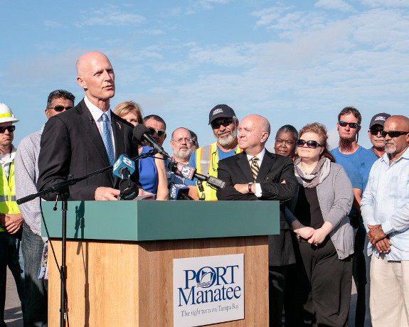 Gov. Rick Scott, pictured here at Port Manatee on March 11, will need to adopt a "climate change" mitigation plan if he wants Florida to be eligible for FEMA funds. (Photo courtesy of Gov.Scott.)